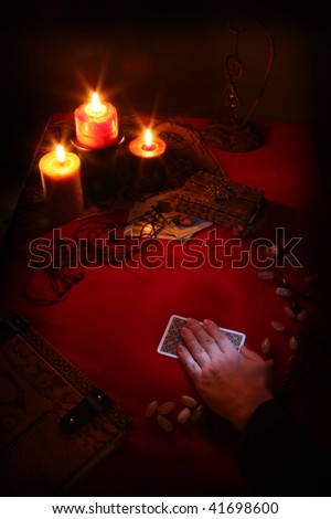 dark tarot reading set with hand