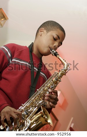 african american male teen playing saxophone