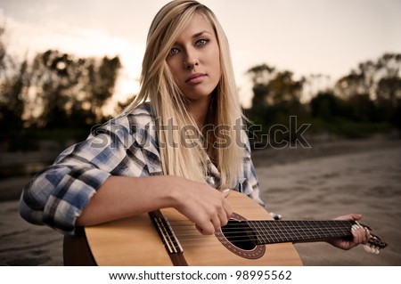 Blonde girl with the guitar