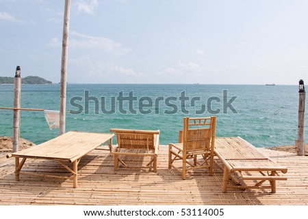 Bamboo chair at thai sea.