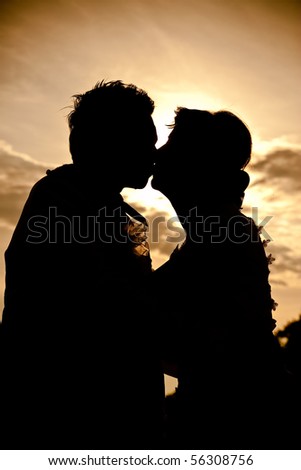 Wedding couple kiss silhouette.