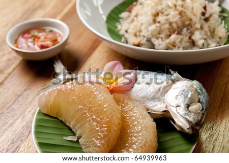 Grapefruit fried rice with tuna fish on banana leaf and sauce fish,Thai food.