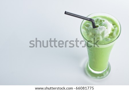 smoothie Green tea with a straw isolated on white background.