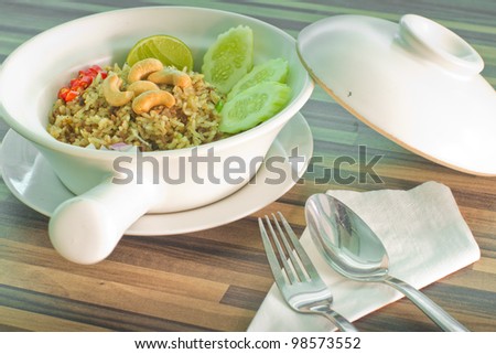 fried rice in a terracotta bowl.