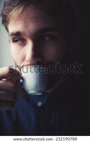 young guy drinking coffee