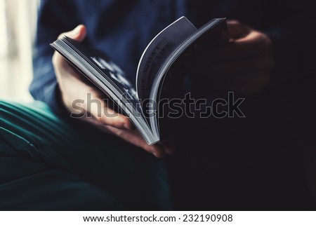 man reading a magazine