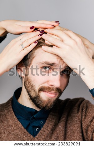 the young man is very upset with hands on head