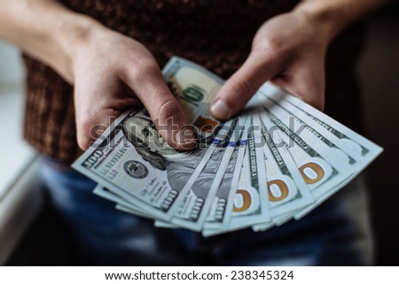 businessman counts money