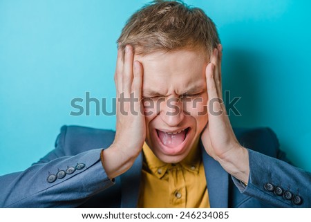Angry business man screaming out loud at someone, portrait of young handsome businessman, concept of executive yelling, conversation problem communication crisis,anger,frustr ation