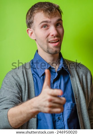 Young man pointing at camera.