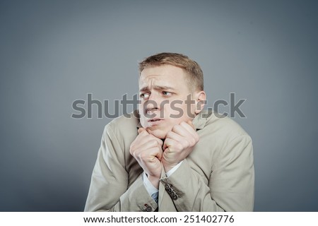 Attractive male head with chin on hands thinking about the cute girl