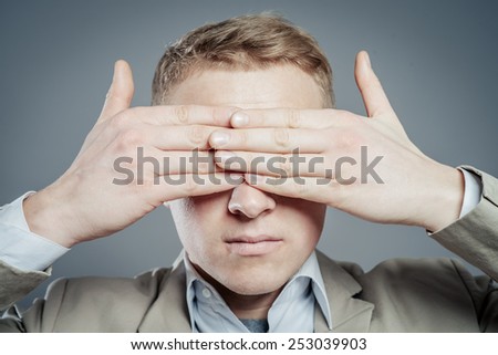 Businessman Covering Eyes Isolated On Grey Background