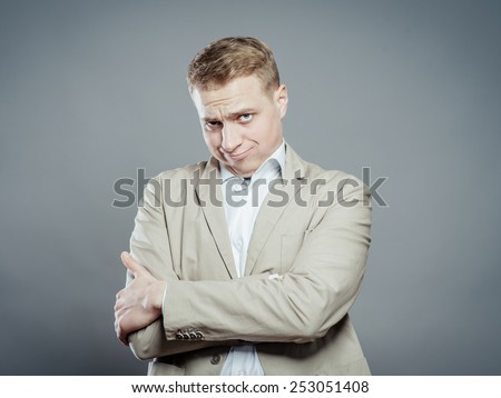 a strong business man distrust looking, and cross hands on his breast