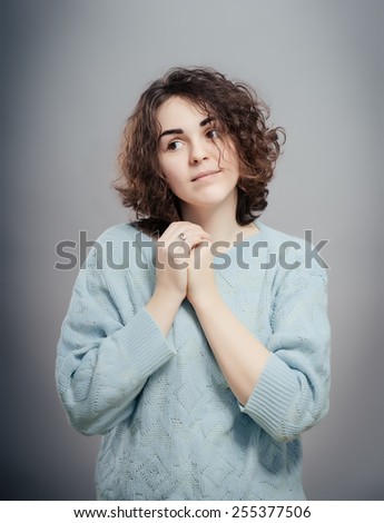 Beautiful casual lady Chest pain, hands crossed on chest isolated on gray