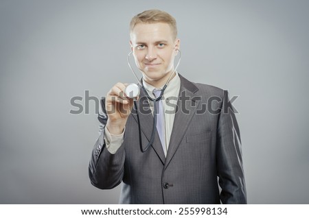 The doctor in a white lab coat holding a stethoscope