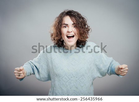 woman screaming because of winning excitement