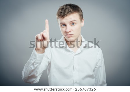 man pointing up with his index finger