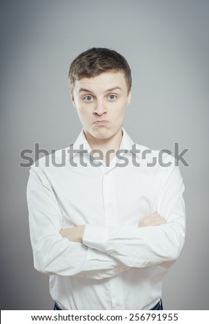 Portrait of disgusted man looking at the camera
