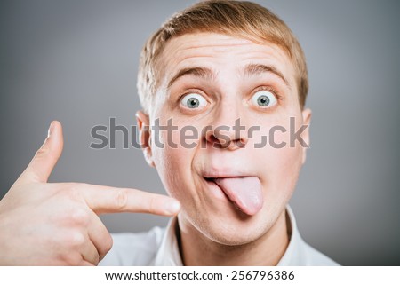 tongue hanging out man isolated  show finger on the tongue