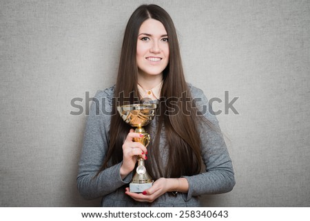 woman winning a trophy. Isolated