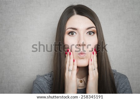 young, upset, worried, troubled brunette woman holding her head with hand