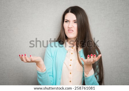 angry confused young dissatisfied woman haired girl in shirt shorts emotions