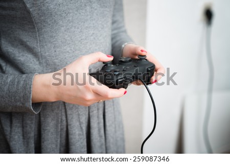 Young girl win a computer game on game console.