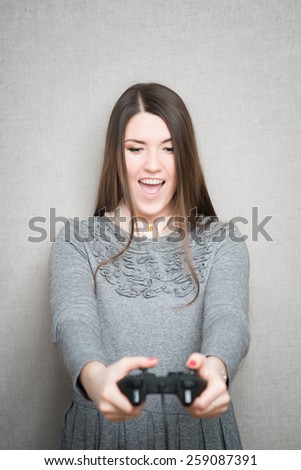 Young girl win a computer game on game console.
