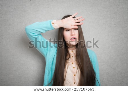 Half-length portrait of woman touching her head. Concept of headache and high temperature