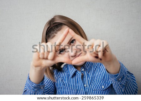 girl shows hands framed