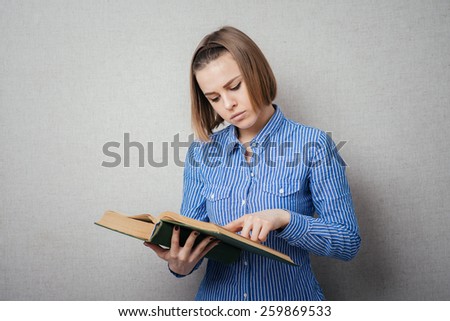 girl reading a book and watching your finger across the page