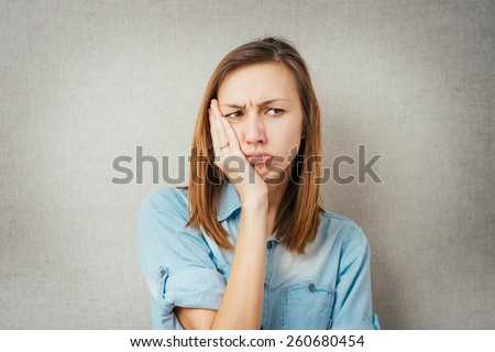 woman is offended or angry. isolated on gray background