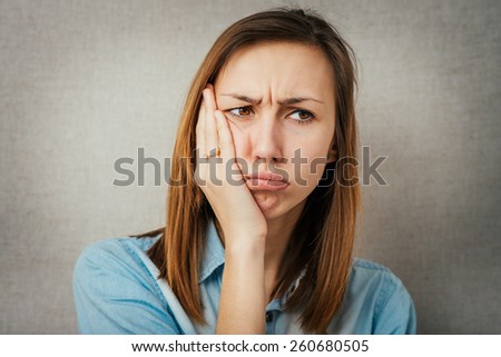woman is offended or angry. isolated on gray background