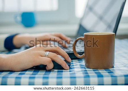 business woman with laptop and cup of coffee
