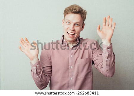 man laughs merrily waving hands