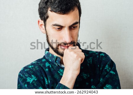 Close-up portrait of an angry young man upset cranky. negative emotion expression feeling