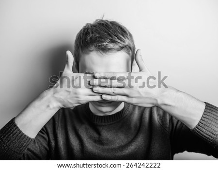 Young man in showing fatigue, sleepy, sleepy, closes his eyes with his hands. gesture. photo shoot.
