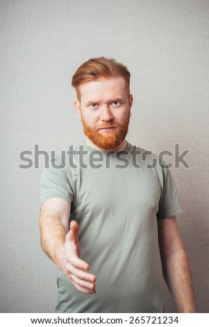man with beard reaching hand