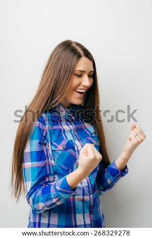 Closeup portrait of winning successful young woman, happy ecstatic celebrating being a winner, isolated on white background. Positive human emotions, facial expressions. Life achievement concept