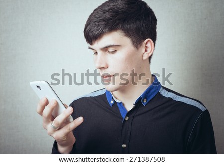 guy dials a number on his cell phone