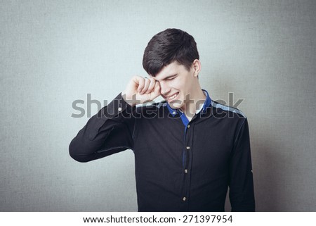 a young and handsome businessman in crying