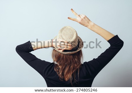 girl in the hat turned back,