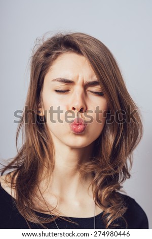 woman show kiss lips, face portrait of business woman. funny face