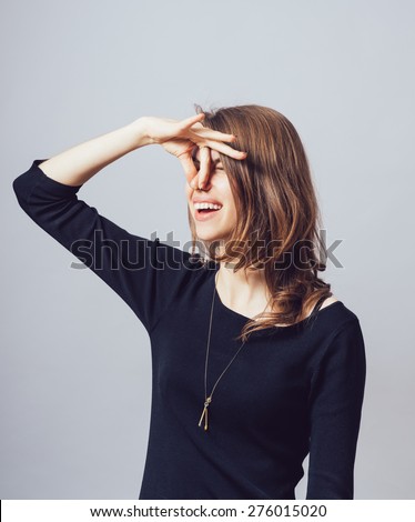 Closeup side view profile portrait young woman, disgust on face, pinches nose, something stinks, very bad smell, situation, isolated gray background. Negative human emotion facial expression feeling