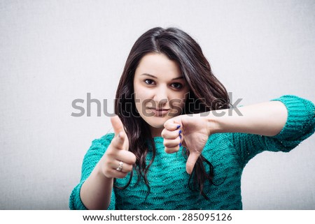 Girl shoots a finger and points down