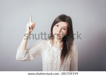 girl shows the index finger up