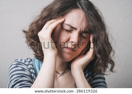 Headache.  woman having a headache