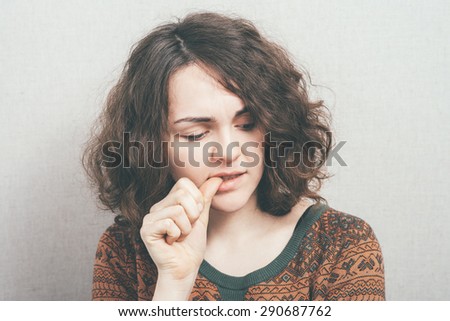 girl bites his nails