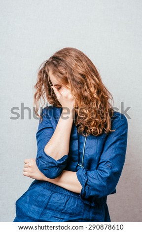 Close-up portrait of surprised attractive businesswoman covering her mouth by the hands, over white background