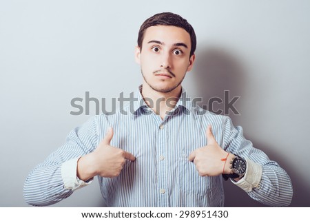Male hand forefinger pointing to himself on the chest. Gesture. who am i. On a gray background